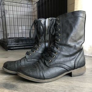 Black lace-up combat boots